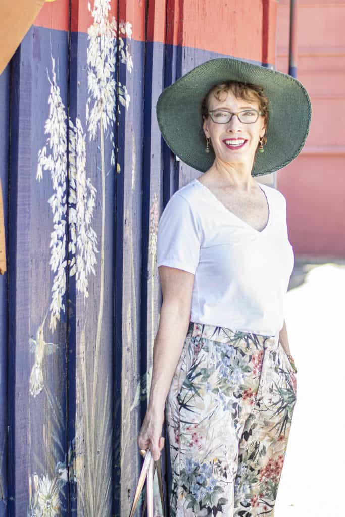 A person standing posing for the cameraDescription automatically generated